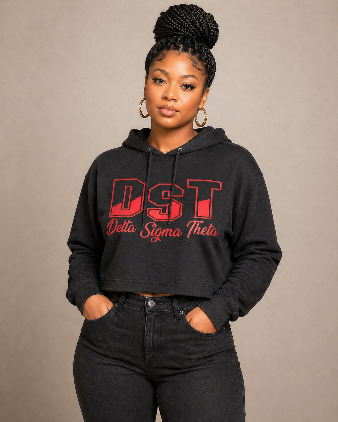 Person wearing a black hoodie with 'DST Delta Sigma Theta' text on a beige background