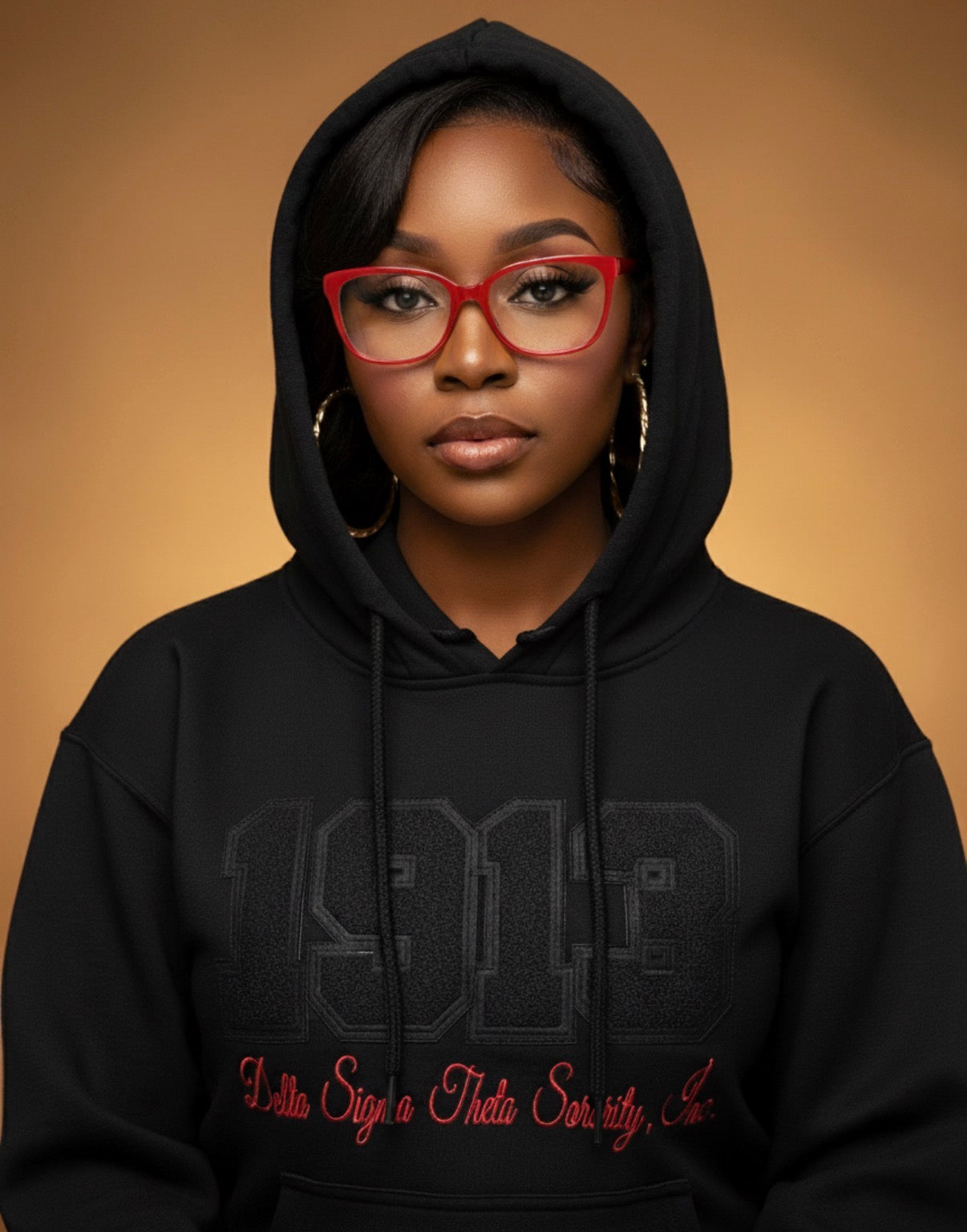 Person wearing a black hoodie with text on a brown background